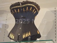 This corset from c.1900 has lacing down both sides and the back and fitted with 28 strips of whalebone. It was patented as having advantages for riding and golfing.
