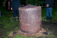 A charcoal kiln with the lid sealed and chimney bases capped to prevent entry of air whilst it cools down.
