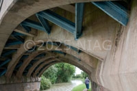Before the West Coast main line was electrified in the early 1960s, Robert Stephenson's bridge of 1838 across the Grand Union Canal was strengthened.